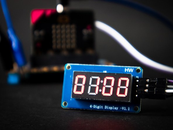 Connect the 7 Segment Display: CLK to Pin 14, DIO to Pin 13, VCC to the + (positive) column, and GND into the - (negative) column.
