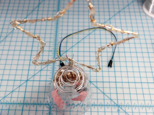 You could trim the NeoPixel strip and remove the unused pixels. However, since they could be unwrapped and reused, hiding the extra pixels inside the cup or in the tree gives you options for later!