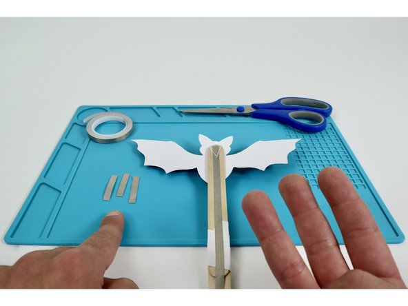 Measure and cut three pieces of Maker Tape that are approximately the same length as the Short LED Legs.