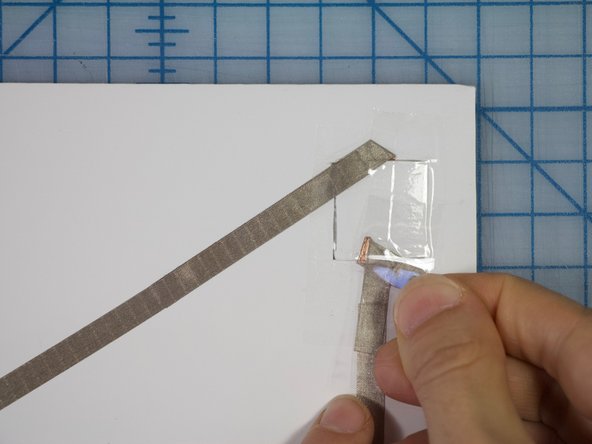 When your circuit is working, place clear tape over the switch to maintain its structure when being pressed.