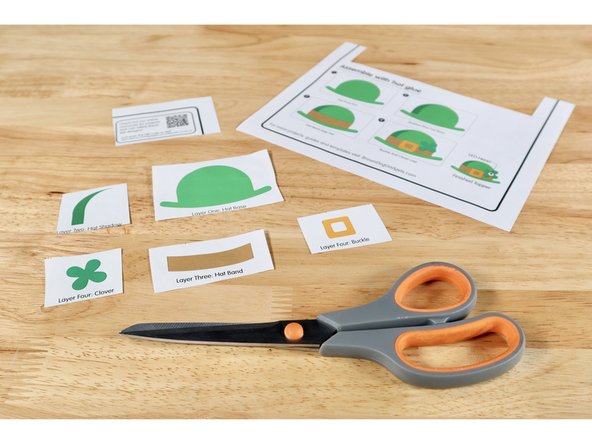 Roughly snip out the templates for each of the five parts of the hat design. All we are doing right now is separating the parts so they can be used to help cut the felt. It is fastest and easiest to leave some white space around each part.