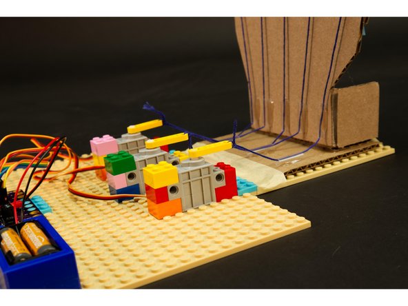 We're going to tie the strings on the servo ends so we can pull them tight at the other end of each string (on the back of the finger).