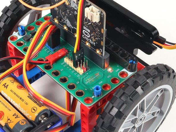 Use the Crazy Circuits Ribbon Cable to connect the NeoPixel Strip to the Bit Board.