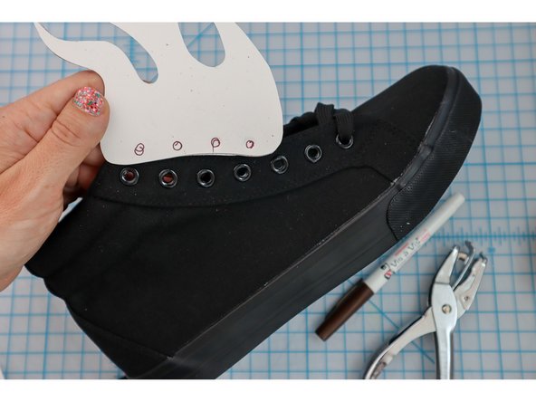 Hold the project up to your shoe and mark the hole locations with a marker.