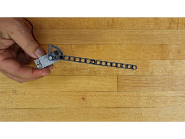 Slide the end of the gate arm onto the shaft of the Servo.