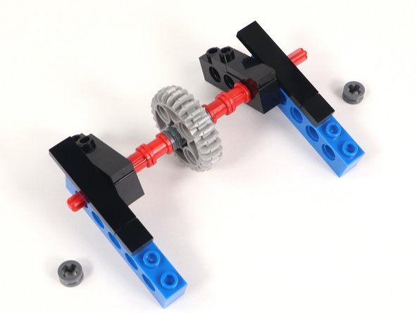 Add a half bushing to each end of the axle to hold everything in place.