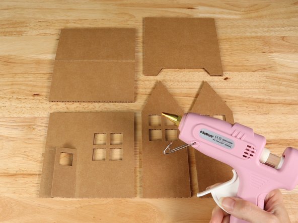 Carefully cut out all 5 panels for the house and assemble using hot glue.
