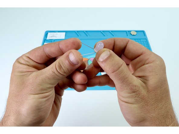 Bend the legs of the LED as shown in photo 3 and the diagram you've clipped and saved. Take care to make these bends so that the LED legs (short and long) are oriented as shown on the  circuit diagram.