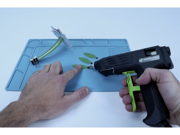 Glue leaves together into a cluster.