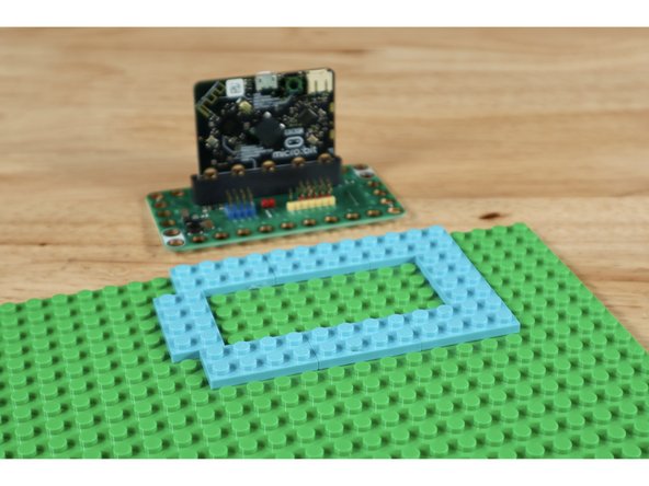 Use 8 (2x4) plates to create the arrangement shown on your base plate. It should be located somewhere along an edge of the base plate to afford ample room for final spacing of the remaining project parts.