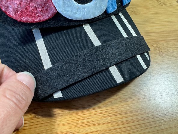 Glue the piece of felt with a dab of glue on the left side to create a slider switch.