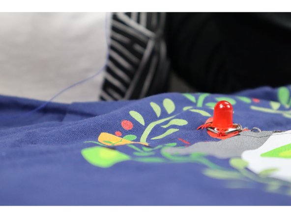 As you make each connection be sure that you're watching for random loose threads. These can be a major source of short circuits. Use fabric glue or tape to help keep all the loose ends from getting out of control on the backside.