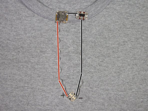 Continue to make connections with the conductive thread as shown. Be sure to start and finish each stitch with a few finishing knots around each of the circuit board holes.