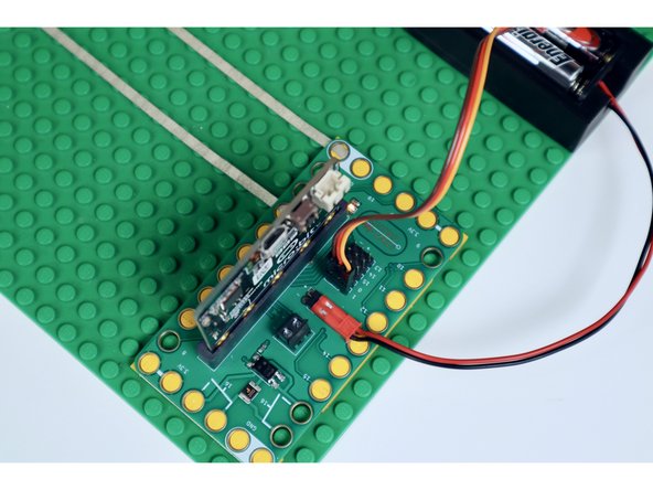 Connect the JST connecter from the battery pack wires to the two pronged power input on the Bit Board (don't worry about orientation as this part will only connect one way).