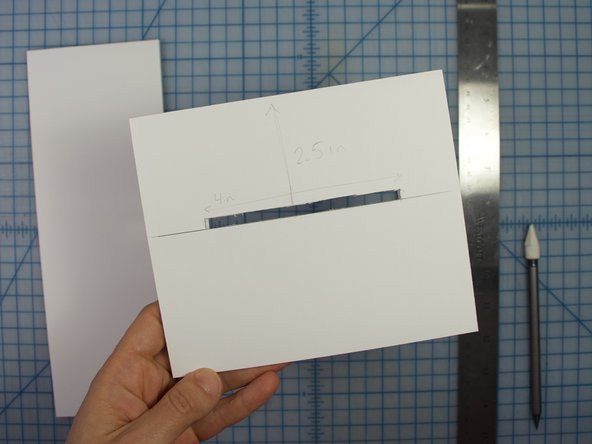 Align the tall piece with the line you just made on the smaller side. Trace around the taller piece.