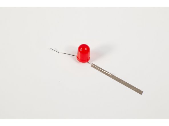 This creates a &quot;tape sandwich&quot; and ensures that the LED leg is touching conductive tape on the top and bottom. Again, making a good connection is the goal.