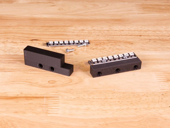 You'll need two 3mm pan head screws. They should be between 6mm long and 10mm long.