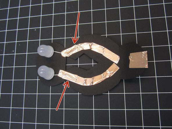 Position your LED legs over each of the lines of tape.