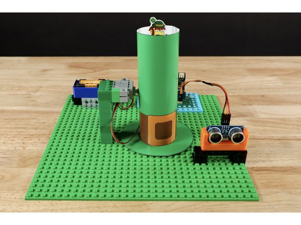 Tip: Briefly disconnect the servo tower at its base and add the connector to the servo axle first. Then press the tower back into place and connect to the axle in the hat. You may need to reach a finger into the hat behind the gear rack to support it from behind as you make the final connection.  
