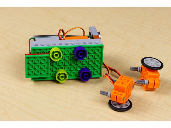 Each servo motor will need to get mounted to the bottom of your robot base.