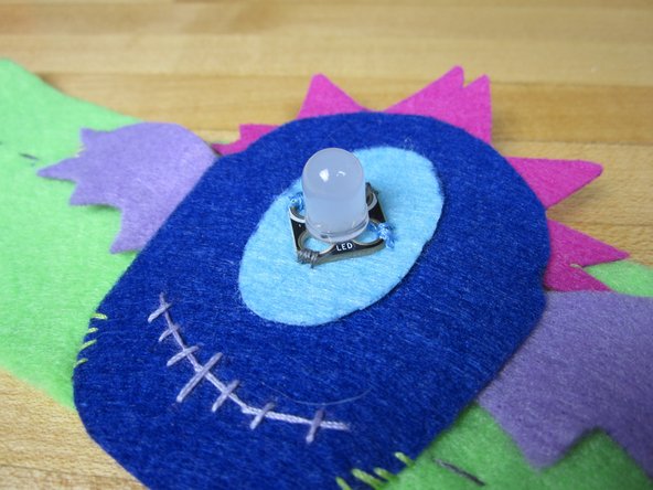 Use the Flying Eye template to create your bracelet topper and use it for steps 23 and 24 in the printable instructions.