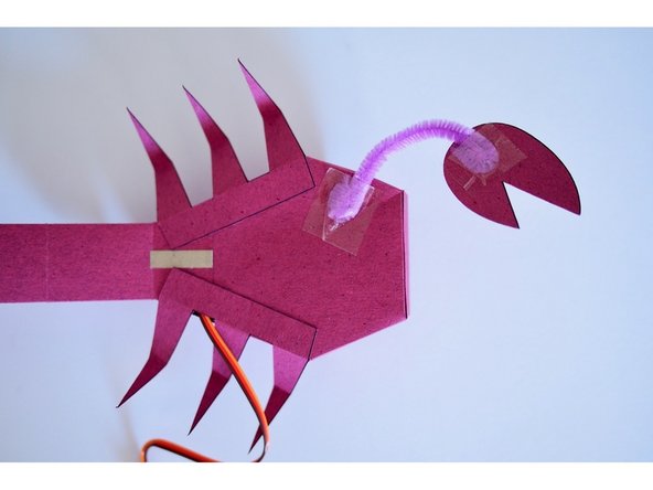 Fold the ends of the pipe cleaner over (this is so the tape has more of a grip area and keeps the pipe cleaner from turning).