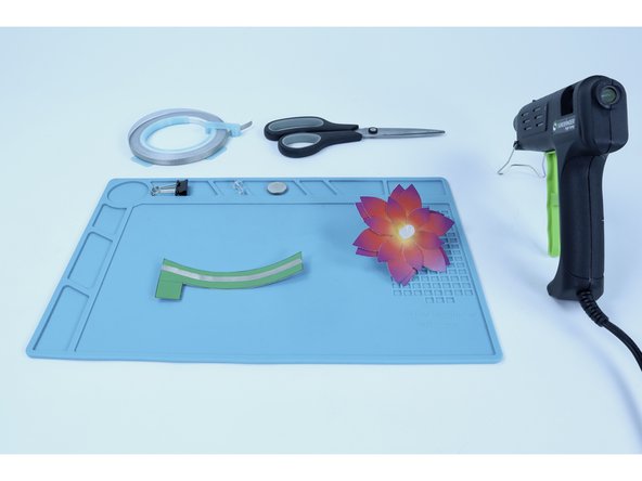 Peel and stick that tape segment where shown in the second photo.