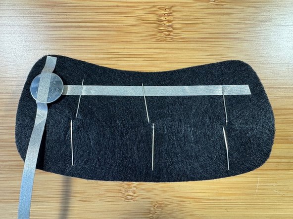 Insert a red, white, and blue LED through the felt from the front.