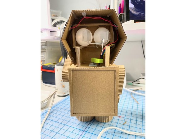 We used the same pink vinyl to cover the interior of her robot body's rear panel.