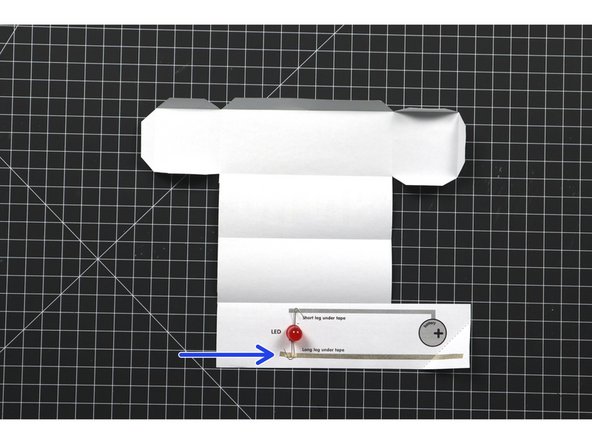 Cut three strips of Maker Tape to build the circuit.
