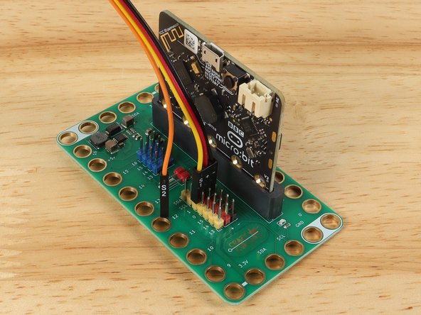 We'll add the 7 Segment Display by using a Crazy Circuits Ribbon Cable. Since each wire is labeled (and color coded) it's easy to make the connections.