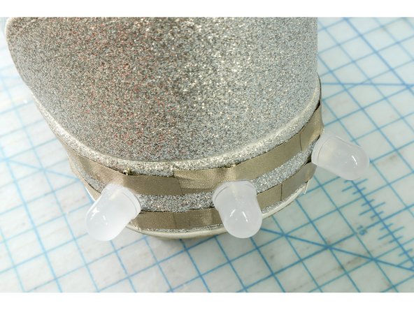 Use small pieces of Maker Tape to connect the LEDs to the circuit as shown.