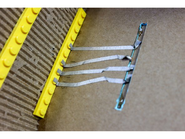 Cut 4, 2-foot pieces of Maker Tape.