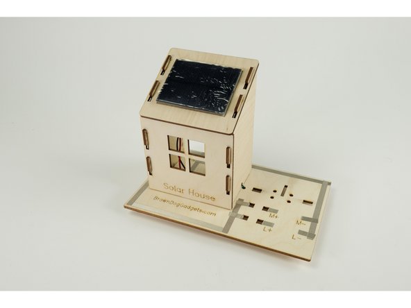 Place the panel face down and apply the two pieces of tape to the left and right side of the panel as shown.