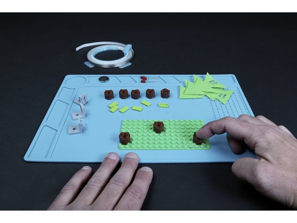 Use the Physical Build Guide found in the docs section to assemble the three tree trunks/baseplate portion of the project.
