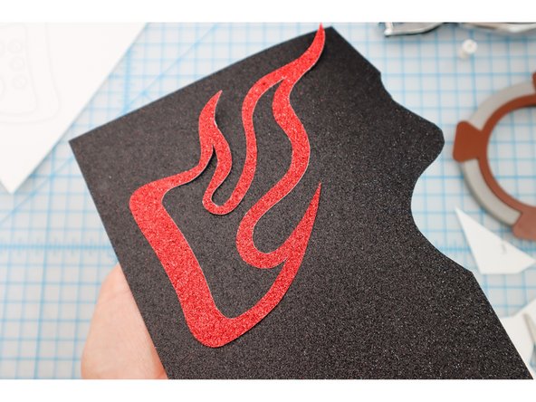 Glue the flame to another color of material and cut it out.