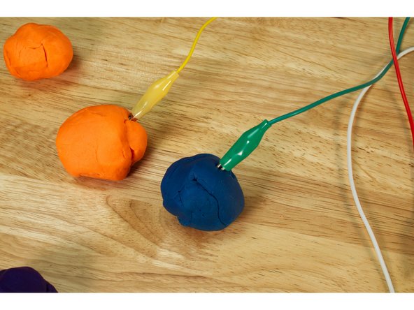 We don’t need to add dough, you can just touch the end of the alligator clips, but dough definitely makes a larger target to hit and a bit more fun.