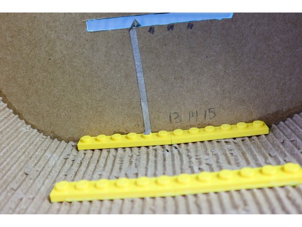 The strings will be connected to pins 11, 13, 14, and 15. Mark the locations of the pins.