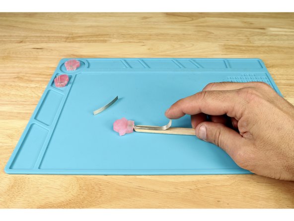 Peel and stick the longer tape path atop the short negative leg.