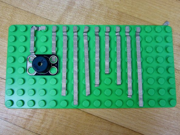 In the above video we used long lengths of tape that connected to patches of Conductive Paint. You can also do the same thing with standard Aluminum Tape from a hardware store.