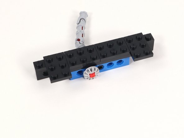 Attach the other (2) 2x3 plates sticking off the front of the build toward the gear side. They should only connect to three studs.