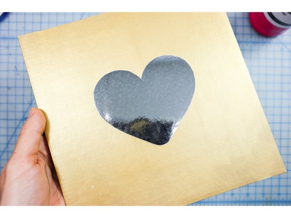 Cut the template from mirror paper and glue it to the cardboard.