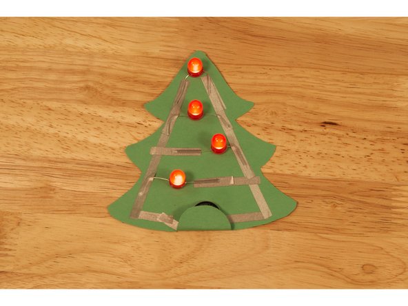 You can then fold the tab over and the tape should hold it in place and light up your circuit!