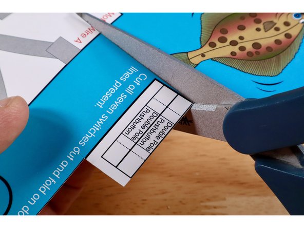 Cut and remove the 2 switch templates labeled &quot;Double Pole Pushbutton&quot; from the switch template bank located in the upper right hand corner of the Flat Fish project poster.