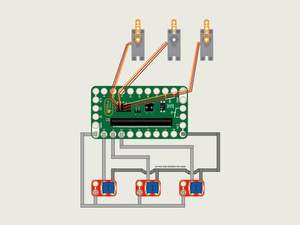 The servos have a three wire connection. The red wire is positive, the brown wire is negative (or ground) and the orange wire is the signal wire.