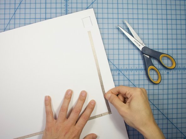 Continue to create a path to the square hole in the poster board.