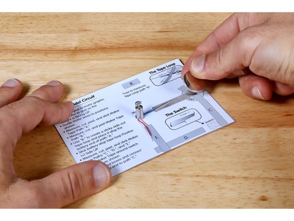 Install your battery by pressing it on top of the tape loop Positive (+) Side UP.