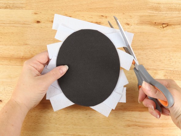 If your strips hang over the edge of the oval by more than an inch you should trim the excess material back so you only have about an inch hanging over the sides of the oval.