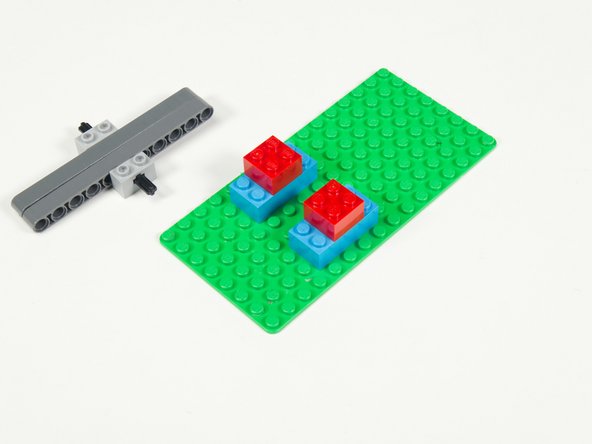 Add two 2 x 2 bricks centered on top of the 2 x 4 bricks.