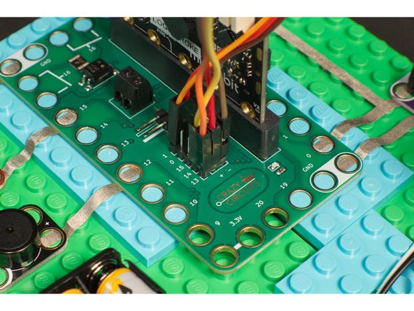 Plug the 7 Segment Display CLK into Pin 14, DIO into Pin 13, Vcc into the + (positive) column, and Gnd into the - (negative) column.